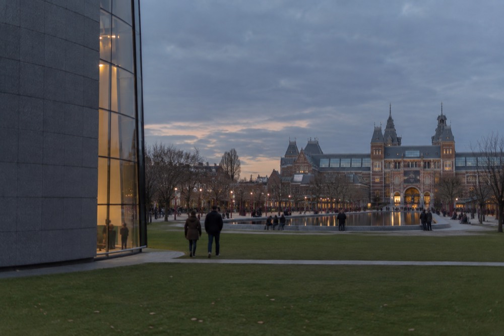 Museum square lawn with a large reflecting pool and grand museum facades behind it