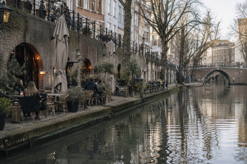 Wharf cellars along the Oudegracht canal in Utrecht with café terraces at water level