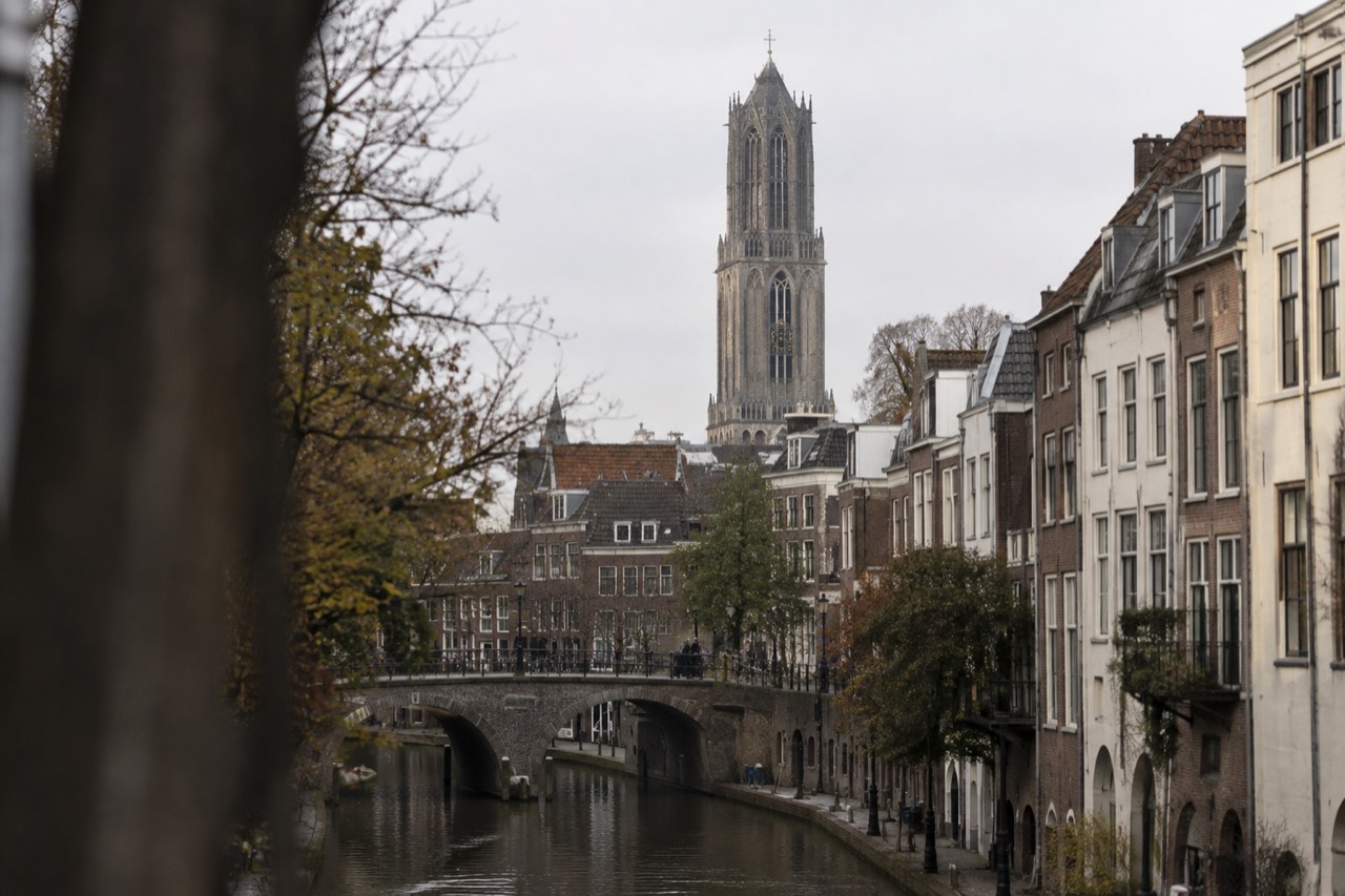 The Dom Tower rising above rooftops in the old centre of Utrecht