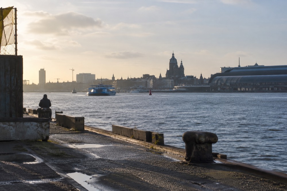 View over the River IJ toward the tower of Centraal Station from the north bank