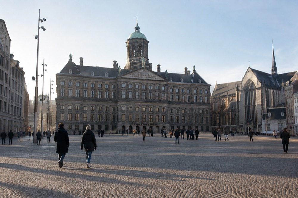 A canal bridge and moored boats close to Dam Square