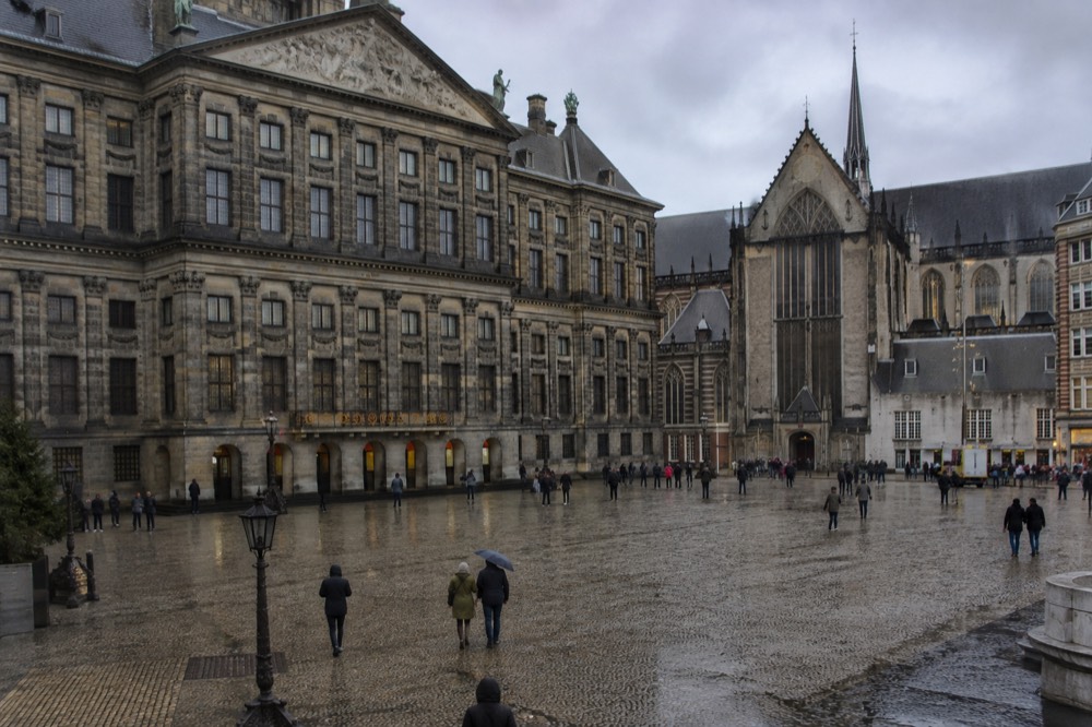 A canal bridge and moored boats close to Dam Square