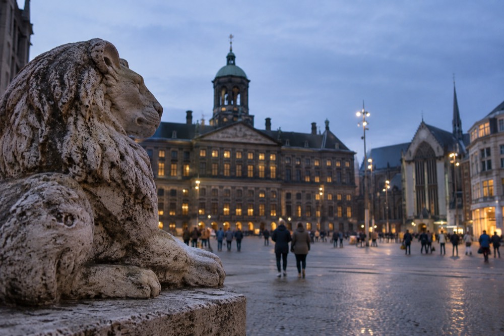 People walking past Dam Square, seen from across the street
