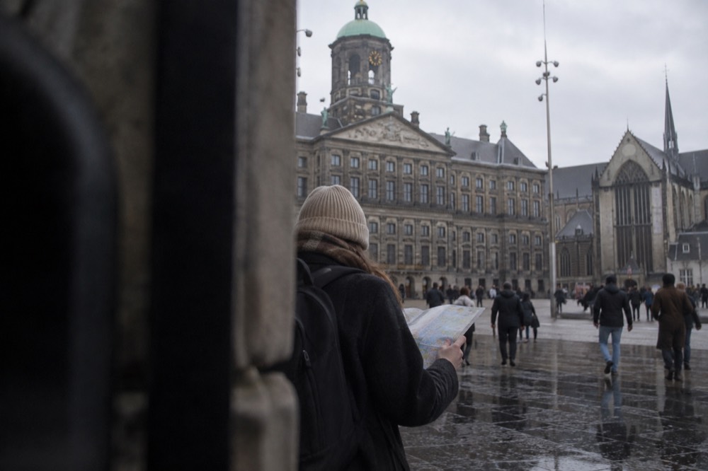 A canal bridge and moored boats close to Dam Square