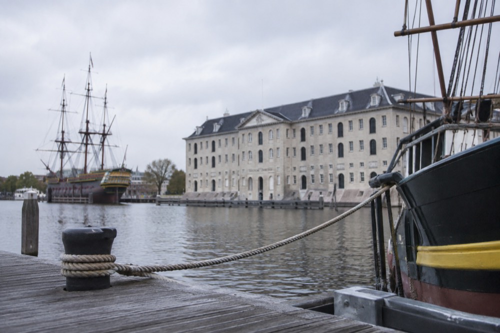 Brick facades and a quiet canal edge beside Scheepvaartmuseum
