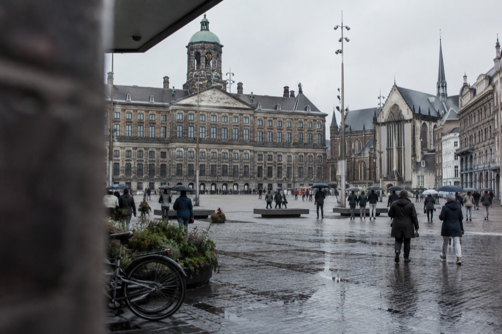A street-level view of Dam Square on an ordinary weekday morning