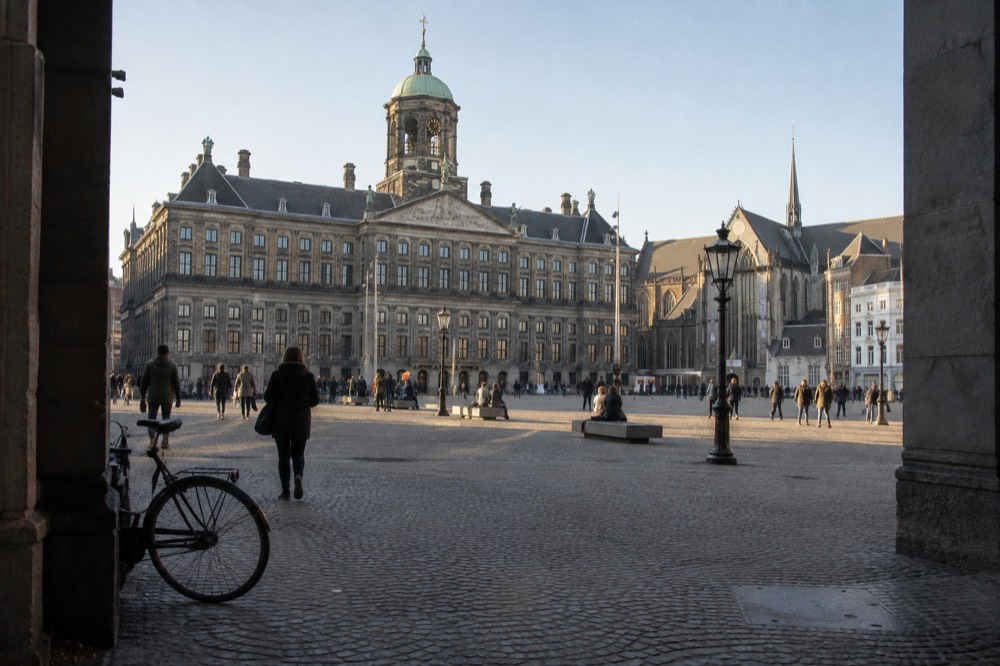 A canal bridge and moored boats close to Dam Square