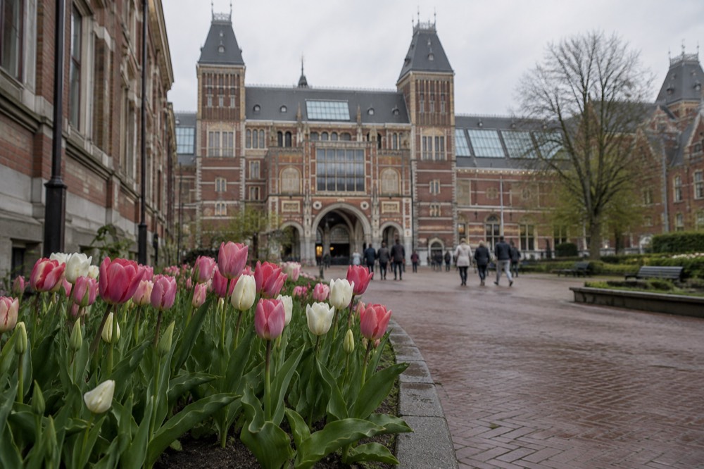 Brick facades and a quiet canal edge beside Rijksmuseum