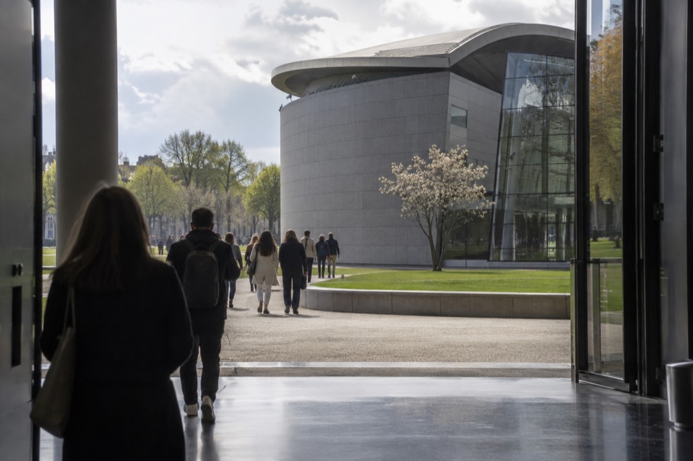 A quiet corner of Van Gogh Museum with trees overhanging the water