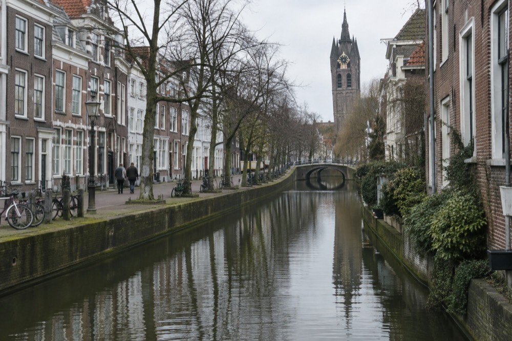 Brick facades and a quiet canal edge beside Delft