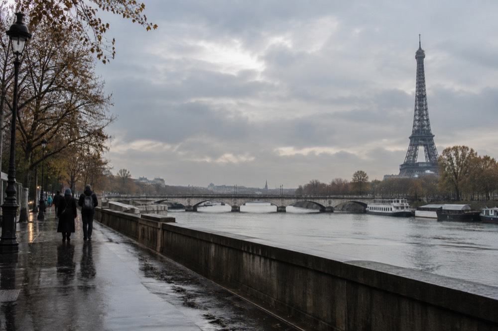A quiet corner of Paris with trees overhanging the water