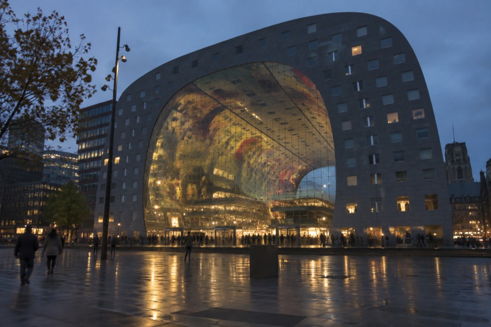 The Markthal building in Rotterdam with its curved glass facade and arched market hall