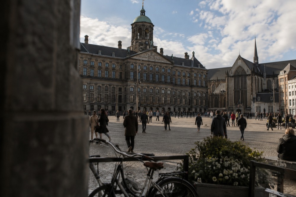 A street-level view of Dam Square on an ordinary weekday morning