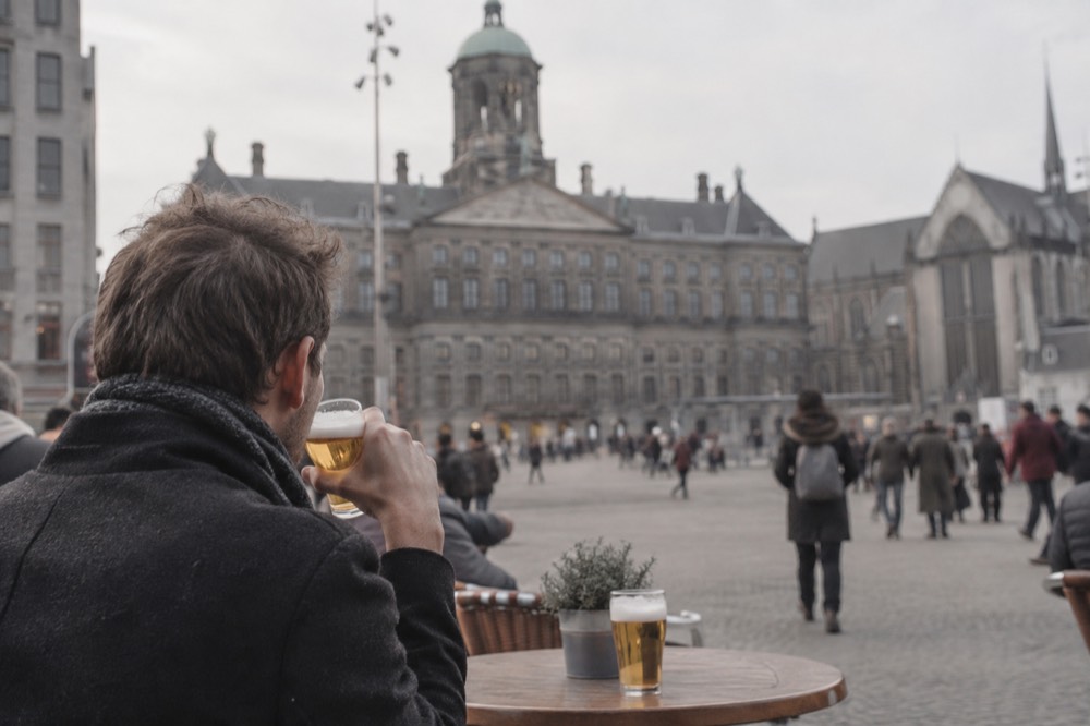 A street-level view of Dam Square on an ordinary weekday morning
