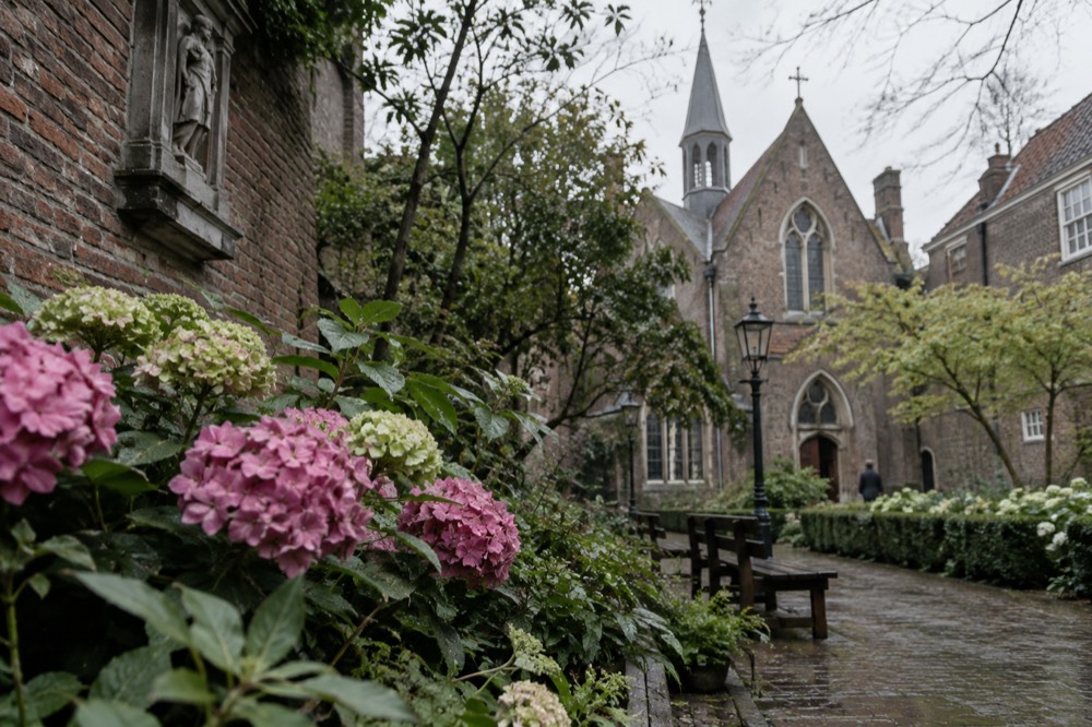 A peaceful hidden garden with a chapel and old brick walls