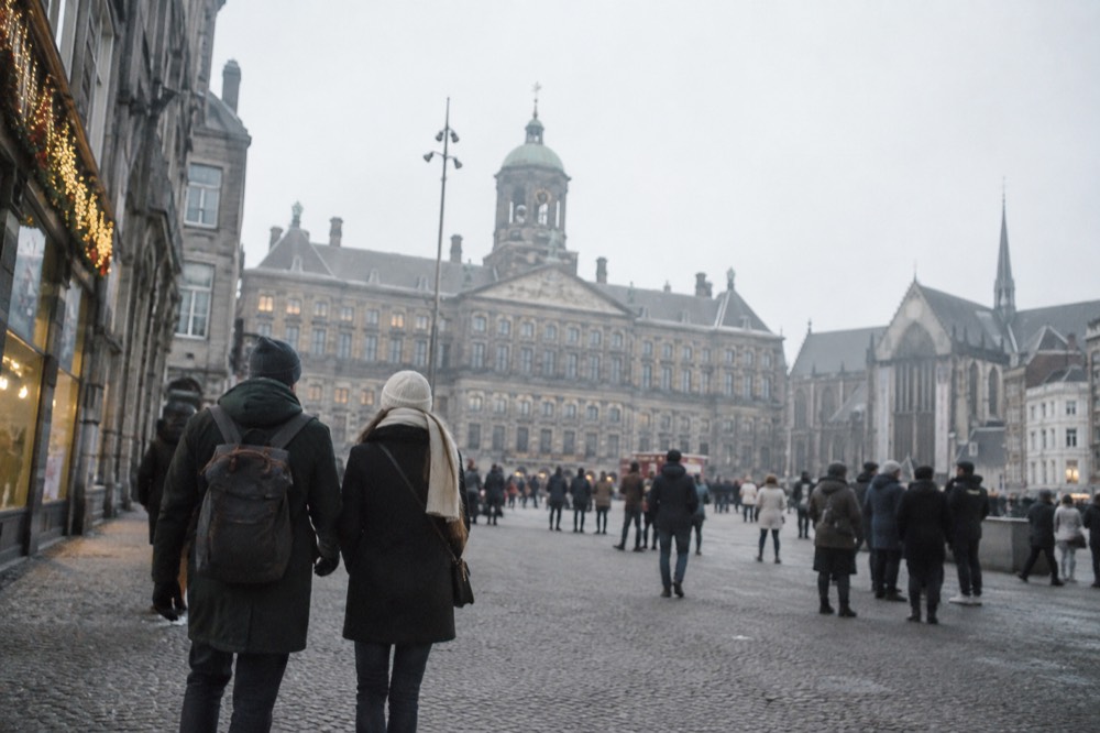 A canal bridge and moored boats close to Dam Square