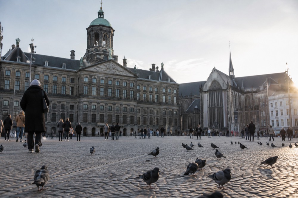 Low winter sun across the rooftops near Dam Square