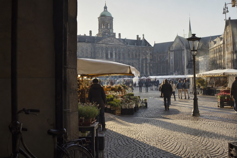 A canal bridge and moored boats close to Dam Square