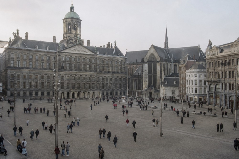 A street-level view of Dam Square on an ordinary weekday morning