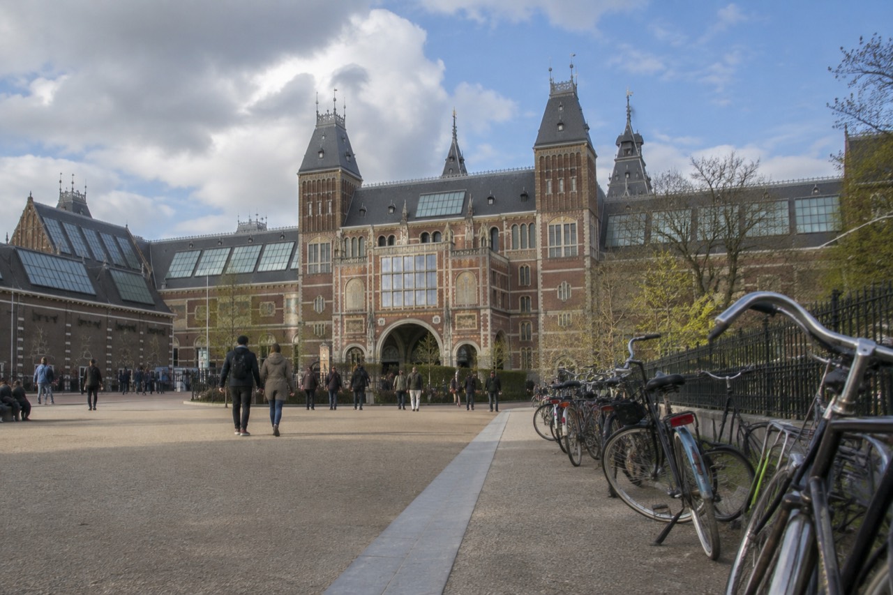 Museumplein in Amsterdam with the Rijksmuseum building and bicycles parked along the edge