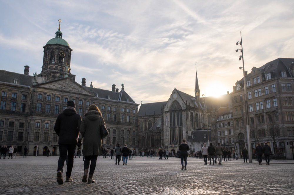 Low winter sun across the rooftops near Dam Square