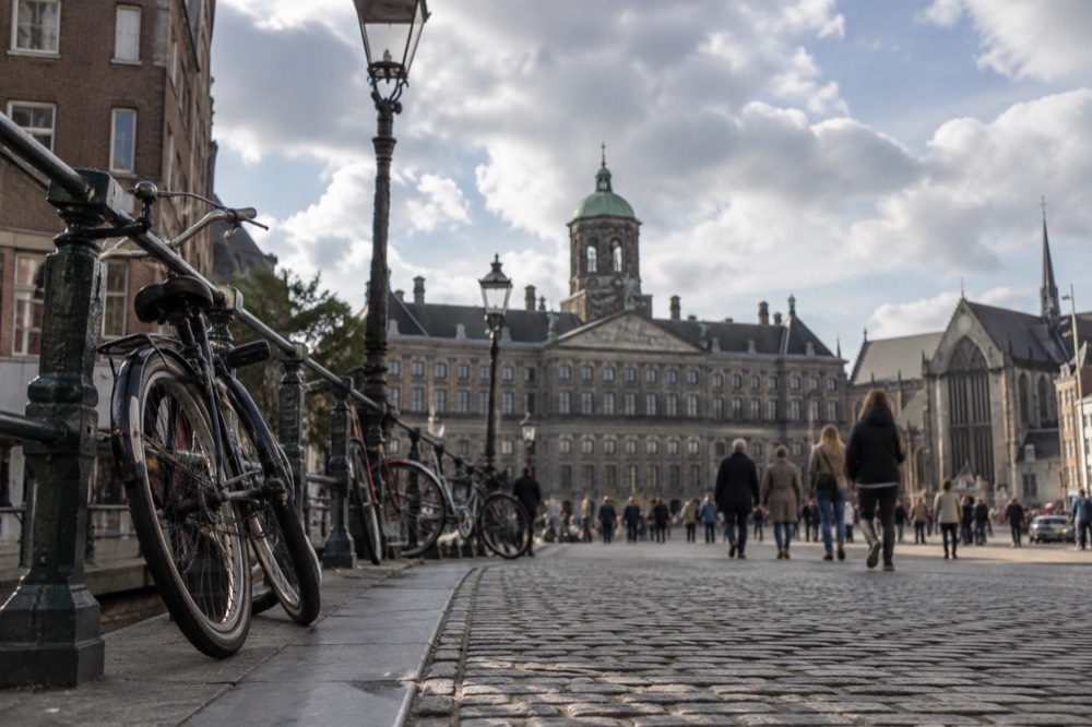 The approach to Dam Square, with bicycles leaning against the railings