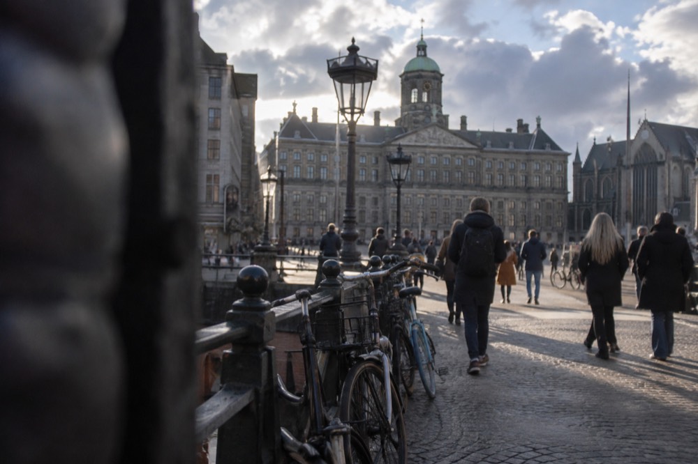 The approach to Dam Square, with bicycles leaning against the railings