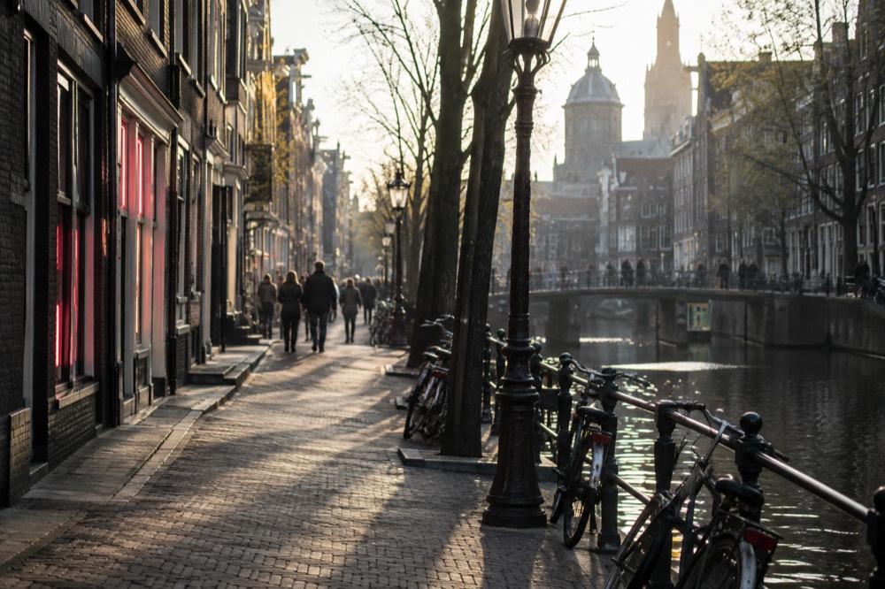 The approach to Red Light District, with bicycles leaning against the railings