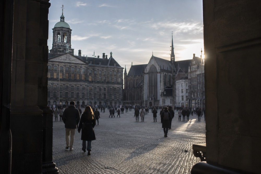 Low winter sun across the rooftops near Dam Square