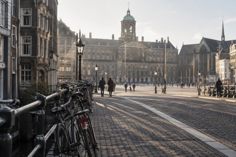 The approach to Dam Square, with bicycles leaning against the railings