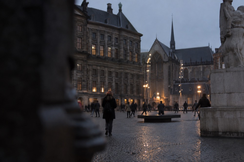 A street-level view of Dam Square on an ordinary weekday morning